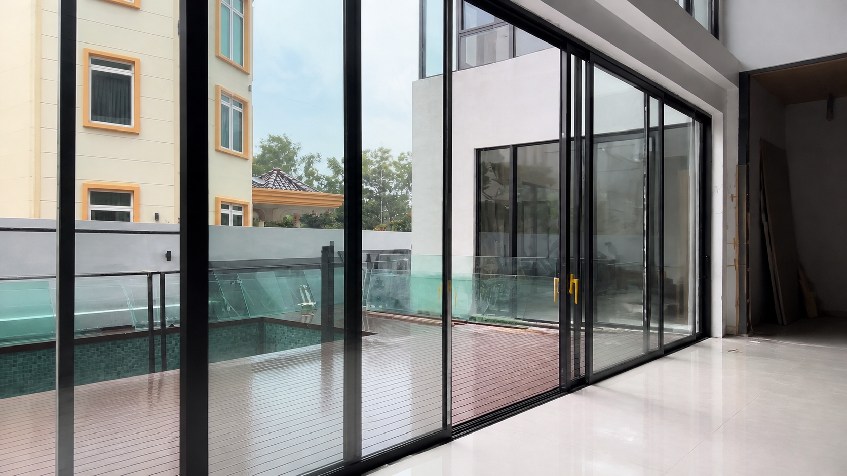 Floor-to-ceiling aluminum sliding glass door system — example related to glass safety, thermal, acoustic and structural fit