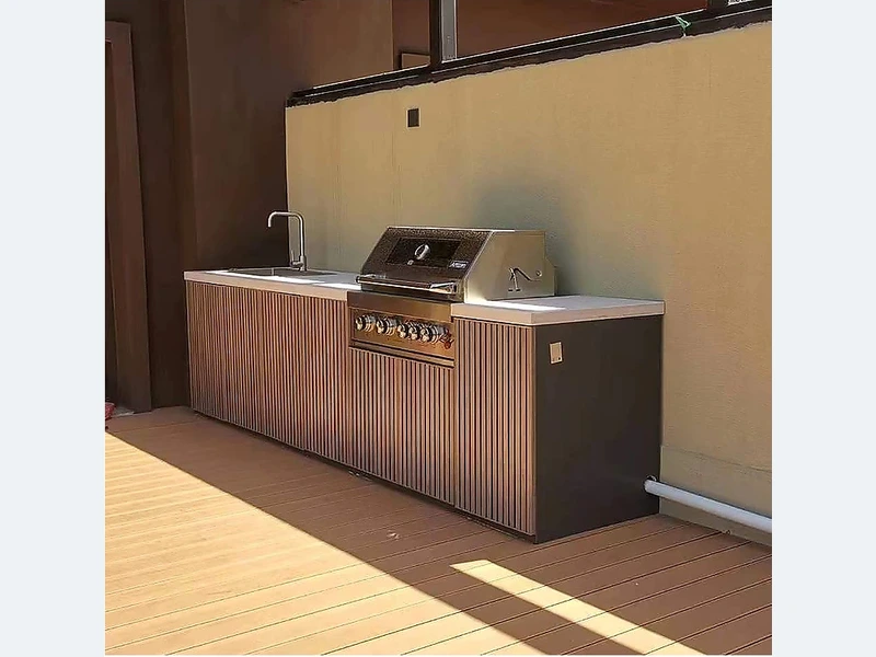 Wood Slat Outdoor Kitchen with Built-In Grill